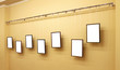 Seven frames with isolated canvas on the exhibition ledge