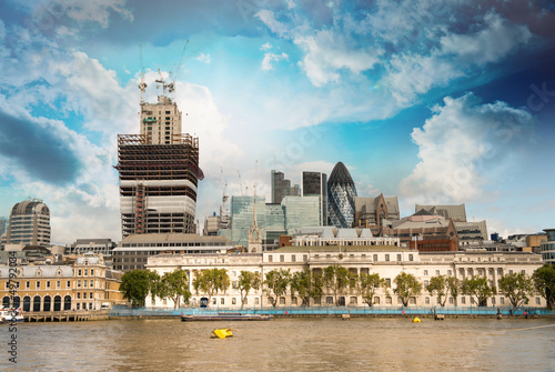 Photo: City of London financial center with Thames river in foreground City of London financial center with Thames river in foreground