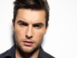 Fashion portrait of young man in black shirt
