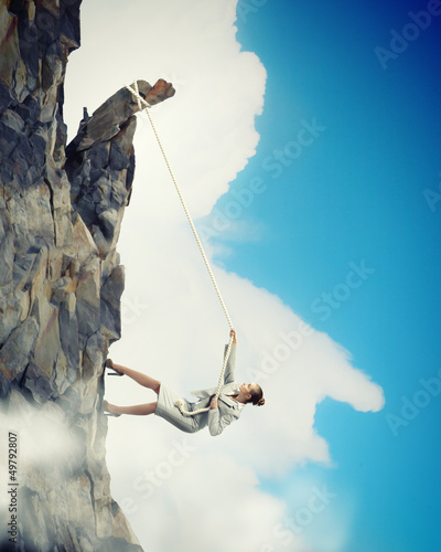 Photo: businesswoman climbing mountain businesswoman climbing mountain