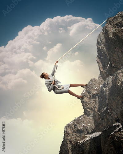 Photo: businesswoman climbing mountain businesswoman climbing mountain