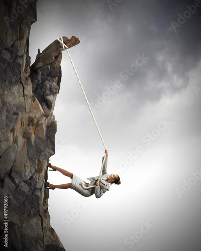Photo: businesswoman climbing mountain businesswoman climbing mountain