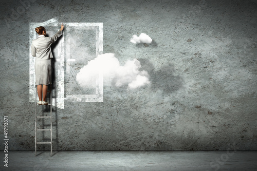 Photo: Business woman on ladder Business woman on ladder
