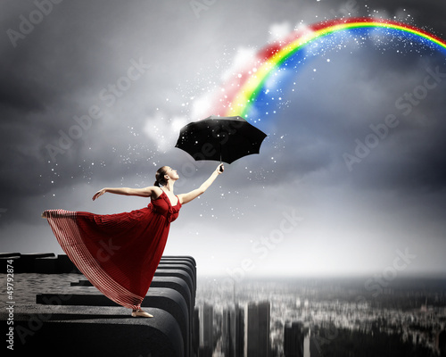 Photo: Ballet dancer in flying satin dress with umbrella Ballet dancer in flying satin dress with umbrella