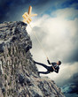 busiessman climbing mountain