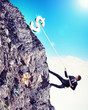 busiessman climbing mountain
