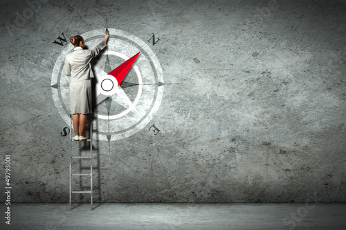 Photo: Business woman drawing compass Business woman drawing compass