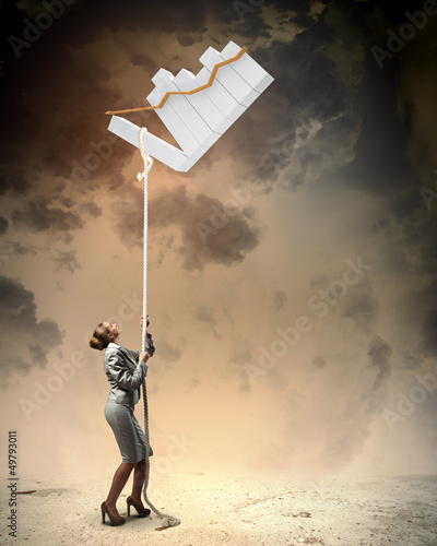 Photo: Image of businesswoman climbing the rope Image of businesswoman climbing the rope