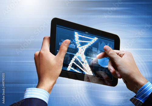 Photo: Dna strand On The Tablet Screen Dna strand On The Tablet Screen