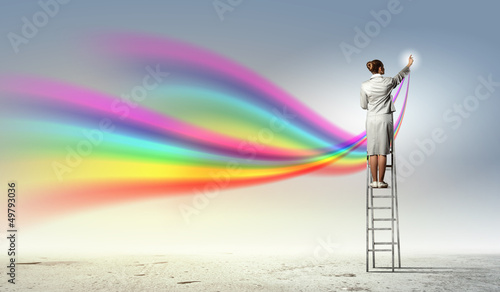Photo: Young woman drawing splashes Young woman drawing splashes