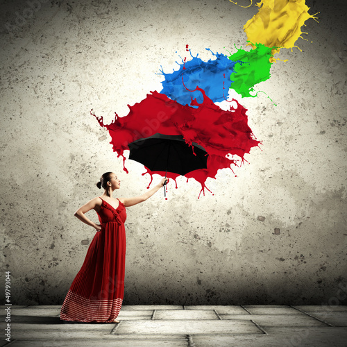 Photo: Ballet dancer in flying satin dress with umbrella Ballet dancer in flying satin dress with umbrella