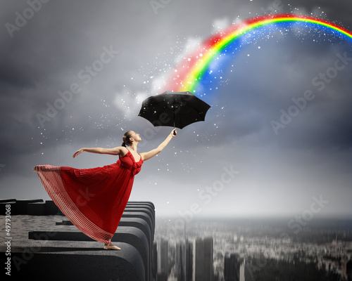 Photo: Ballet dancer in flying satin dress with umbrella Ballet dancer in flying satin dress with umbrella