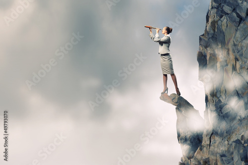 Photo: Business woman with telescope Business woman with telescope