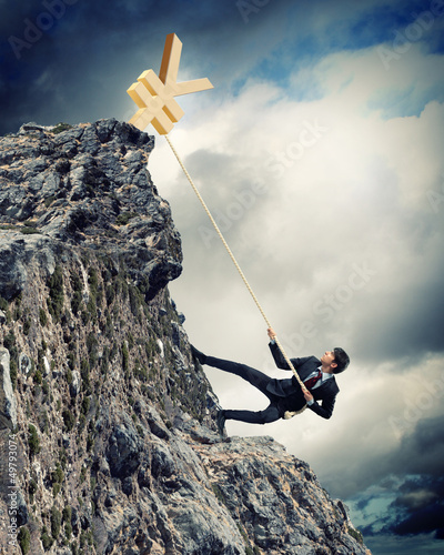 Photo: busiessman climbing mountain busiessman climbing mountain