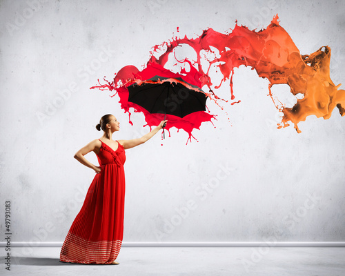 Photo: Ballet dancer in flying satin dress with umbrella Ballet dancer in flying satin dress with umbrella