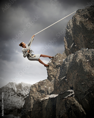 Photo: businesswoman climbing mountain businesswoman climbing mountain