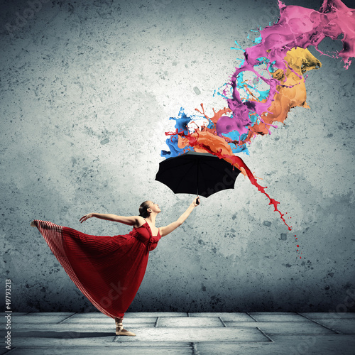 Photo: Ballet dancer in flying satin dress with umbrella Ballet dancer in flying satin dress with umbrella
