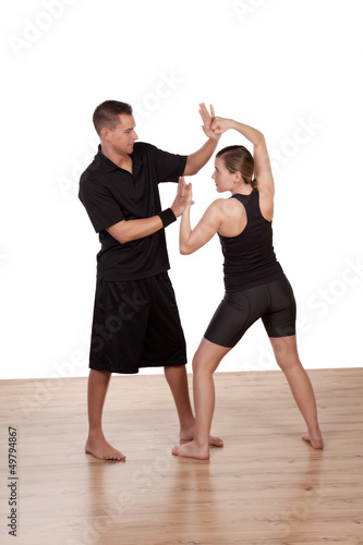 Photo: Young girls practicing with a fitness trainer Young girls practicing with a fitness trainer