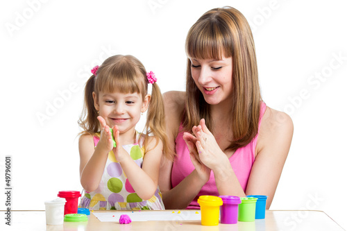 Photo: mother teeaching daughter to use colorful play dough mother teeaching daughter to use colorful play dough