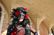Venetian costume attends Carnival of Venice.