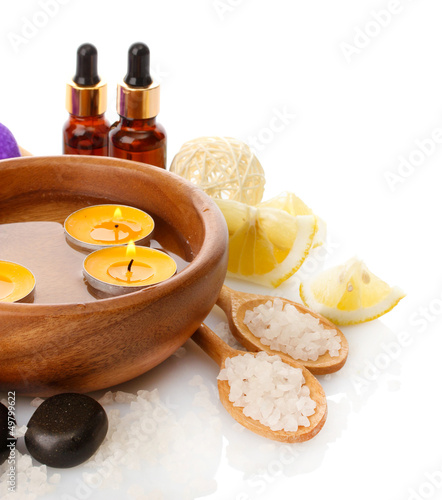 Photo: Beautiful spa setting with orange, isolated on white Beautiful spa setting with orange, isolated on white