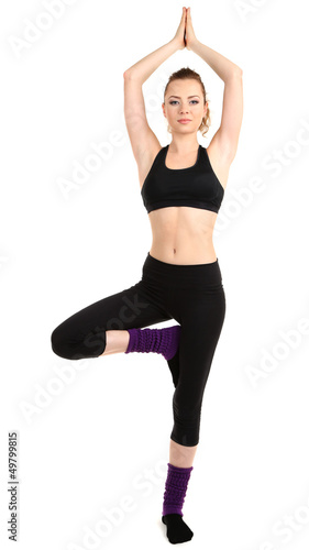 Photo: Young women in yoga style isolated on white Young women in yoga style isolated on white