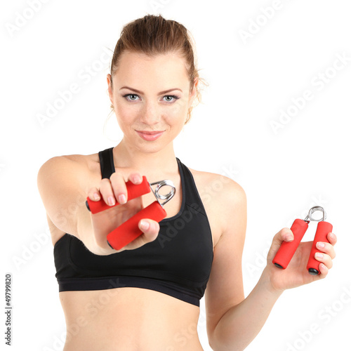 Photo: Young woman with carpal expander isolated on white Young woman with carpal expander isolated on white