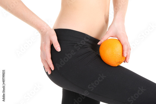 Photo: Beautiful female figure with orange isolated on white Beautiful female figure with orange isolated on white