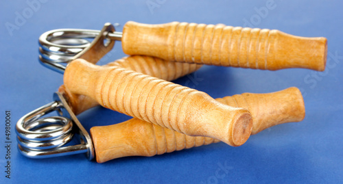 Photo: Modern hand trainer on blue background Modern hand trainer on blue background