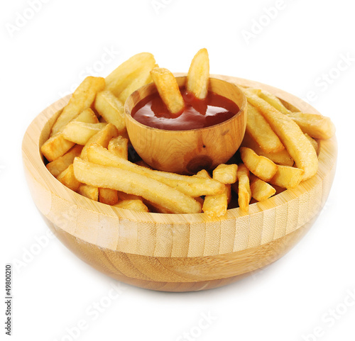 Photo: French fries in bowl isolated on white French fries in bowl isolated on white
