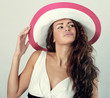 beautiful woman in a white hat from the sun.