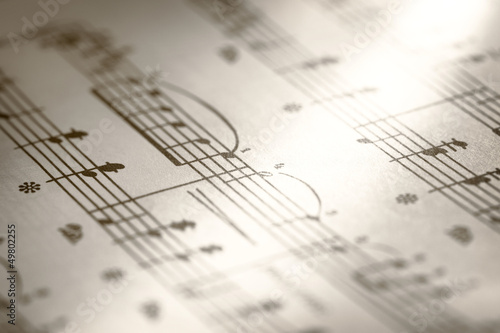 Photo: Music notes on paper background Music notes on paper background