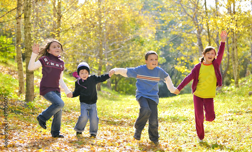 Photo: Happy kids and autumn leaves Happy kids and autumn leaves
