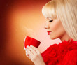 Pretty blonde woman with coffee or tea