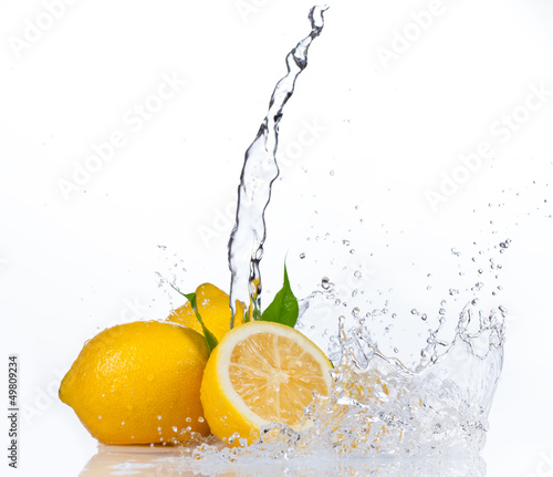 Photo: Fresh lemons with water splash, isolated on white background Fresh lemons with water splash, isolated on white background