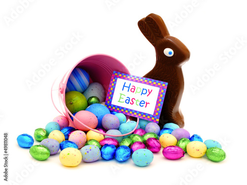 Photo: Happy Easter card and pink pail spilling candy Happy Easter card and pink pail spilling candy