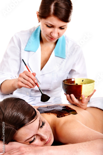Photo: Woman having chocolate body mask. Woman having chocolate body mask.