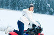 Photo: Woman and snowmobile Woman and snowmobile