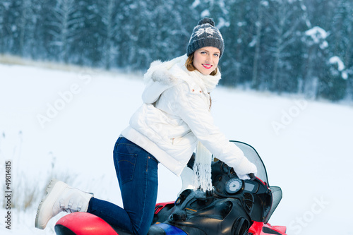 Photo: Woman and snowmobile Woman and snowmobile