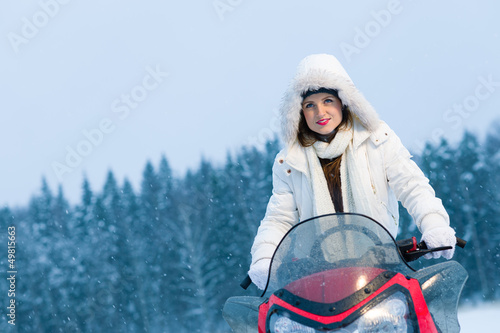 Photo: Woman and snowmobile Woman and snowmobile