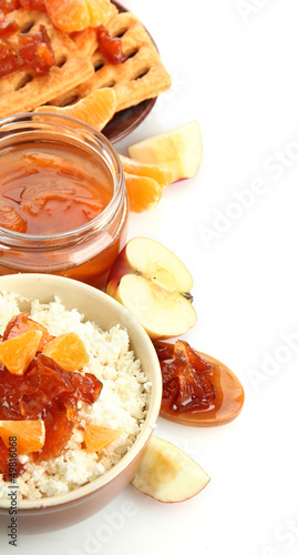 Photo: cottage cheese in bowl with homemade fruit jam, isolated cottage cheese in bowl with homemade fruit jam, isolated