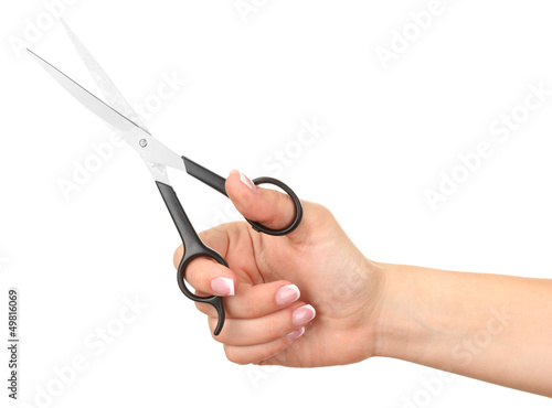 Photo: Female hand with scissors isolated on white Female hand with scissors isolated on white