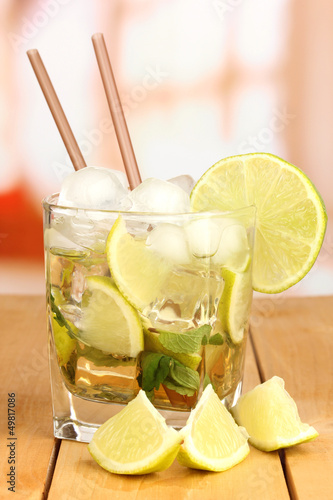Photo: Glass of cocktail with lime and mint Glass of cocktail with lime and mint