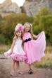 Photo: Beautiful little girl in a pink dress walking Beautiful little girl in a pink dress walking
