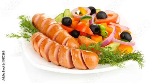 Photo: Grilled sausage with fresh salad isolated on white Grilled sausage with fresh salad isolated on white