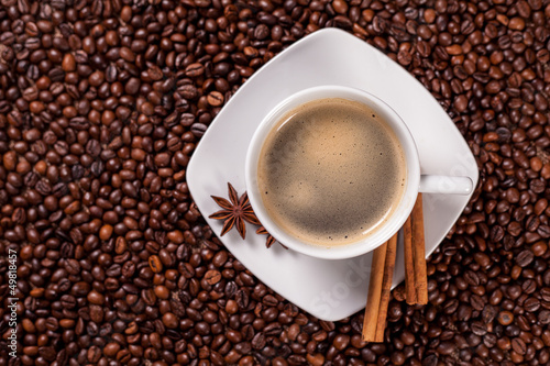 Photo: High angle view of a coffee cup with cinnamon High angle view of a coffee cup with cinnamon