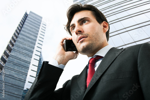 Photo: Businessman talking on the phone Businessman talking on the phone