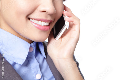 Photo: close up of business woman speaks phone close up of business woman speaks phone
