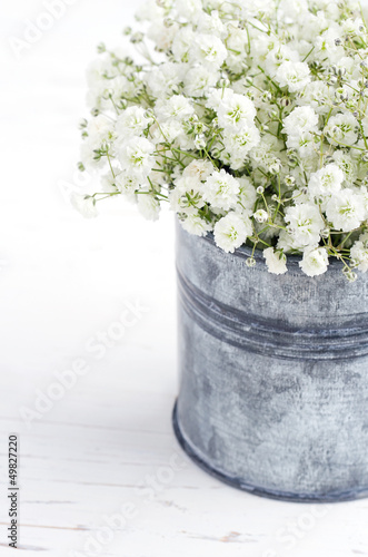 Photo: Bouquet of baby's breath flowers, on wooden background Bouquet of baby's breath flowers, on wooden background