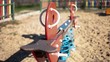 Video: Colorful play equipment in the sand on a playground Colorful play equipment in the sand on a playground
